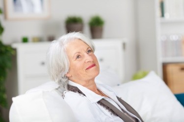 daydreaming-smiling-elderly-woman